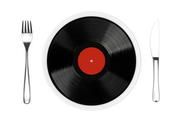 istock Good Taste in Music Concept. Vinyl Disk on Plate with a Fork and a Knife. 3d Rendering 1502780408