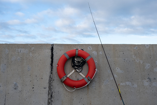 Lifebuoy hanging on the wharf shore