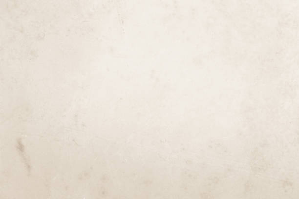 istock Colour old concrete wall texture background. Close Up retro plain cream color cement wall background texture. Design paper vintage parchment element show or advertise or promote product on display. 1502785687