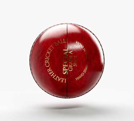 A regular red cricket ball with white stitching and generic gold branding on an isolated background - 3D render