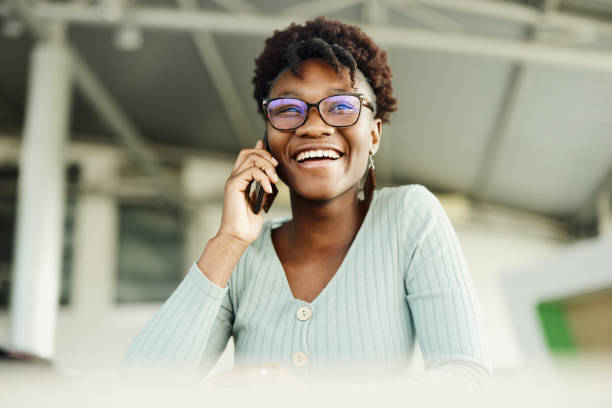 istock Happy black woman talking on mobile phone. 1502799416