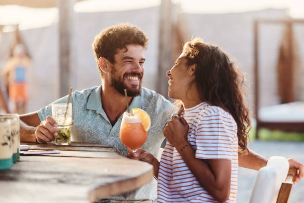 istock Cheerful couple talking in a bar. 1502801651