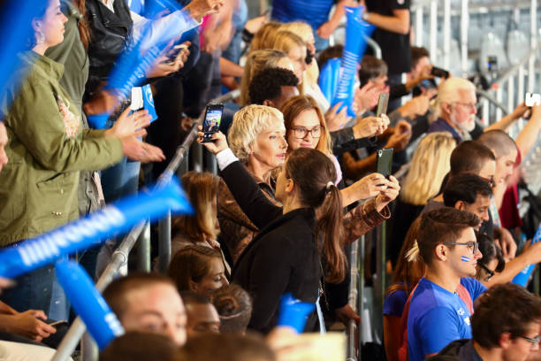 istock Woman taking selfies at a footbal match 1502802224