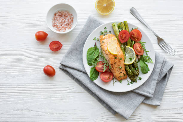 istock Baked Delicious salmon, green asparagus on  plate 1502802371