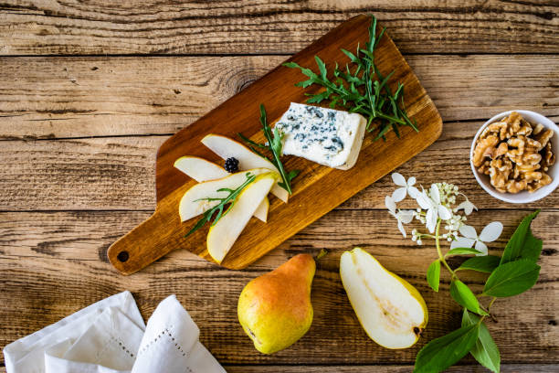 istock Cheese salad - blue cheese, walnuts, pear and blackberries on wooden background 1502803657