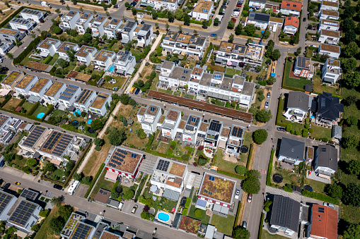 Aerial view of a neighborhood with different types of modern residential buildings.