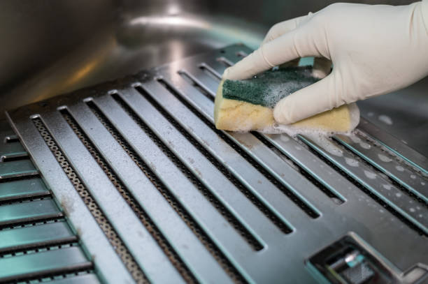 istock Someone hands using sponge to cleaning a cooker hood filters at kitchen sink. 1502810507