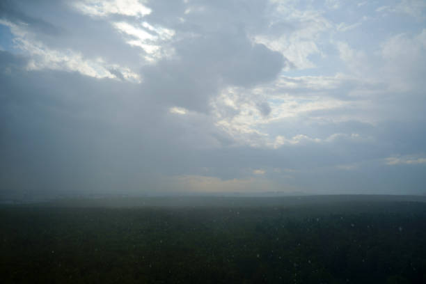 The overcast sky with drifting clouds foretells a coming storm.