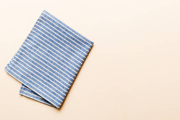 istock top view with blue kitchen napkin isolated on table background. Folded cloth for mockup with copy space, Flat lay. Minimal style 1502817793