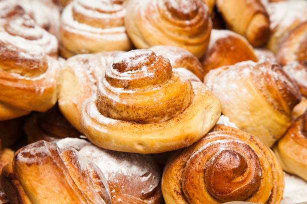 istock Homemade baking. Baked cinnamon rolls sprinkled with powdered sugar. 1502819199