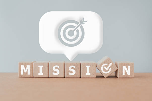 istock MISSION text on wooden cube blocks with correct check instead of O and white speech bubble with dartboard icon. For business purposes and strategy, planning concept 1502821422