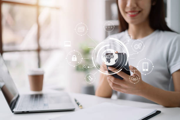 istock Person typing laptop computer and smartphone with SDK icon on virtual screen. SDK Software development kit programming language technology concept in office. 1502831294
