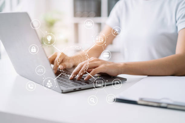 istock Copyright or patent concept, Person hand using laptop computer, tablet and smartphone with virtual screen copyright icon trademark, Creation ownership against piracy at office. 1502831320