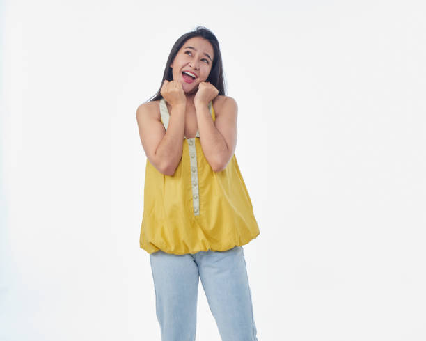 istock Happy woman showing something on white background 1502836530