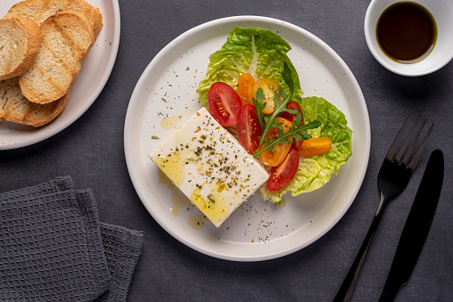 Food photography of feta cheese salad, greek, tomato, romaine, cheese, lettuce, seasoning, olive oil, toast