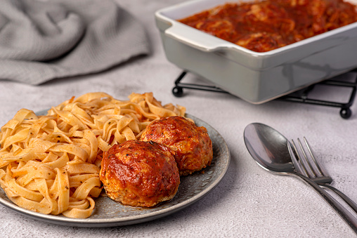Food photography of meatball, tagliatelle; pasta, minced, beef, chicken, pork, meat, tomato sauce, italian
