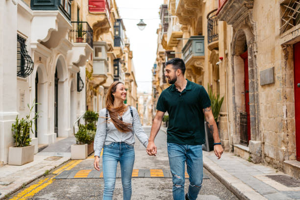 istock Young Couple Walking Through The City In Valletta Malta 1502841105