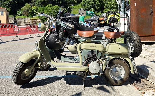 Udine, Italy. June 25, 2023.  Vintage scooter Innocenti  Lambretta Model C 125 at the roadside during a  motorbike gathering.