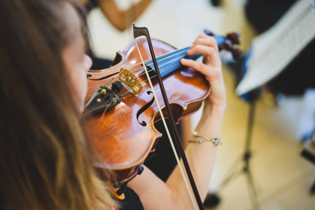 istock Unrecognizable woman playing the violin in public 1502843677