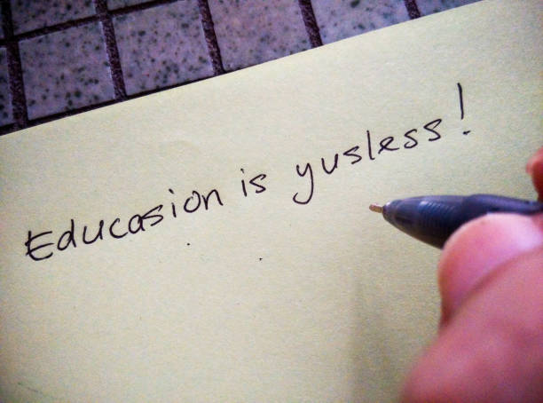 Concept: education is important Penang, Malaysia 

Conceptual - without education, you won't know even the most basic, like spelling of words.

Photos of a hand holding a pen over a paper. Phrases, written (by me) on a piece of paper, ridiculing the importance of education. Words in my phrases are misspelled intentionally to show the result of poor education.
Phrases are:
I don't nid schuul,
Educasion is yusless,
I can survaive with no educasion!! misspelled stock pictures, royalty-free photos & images