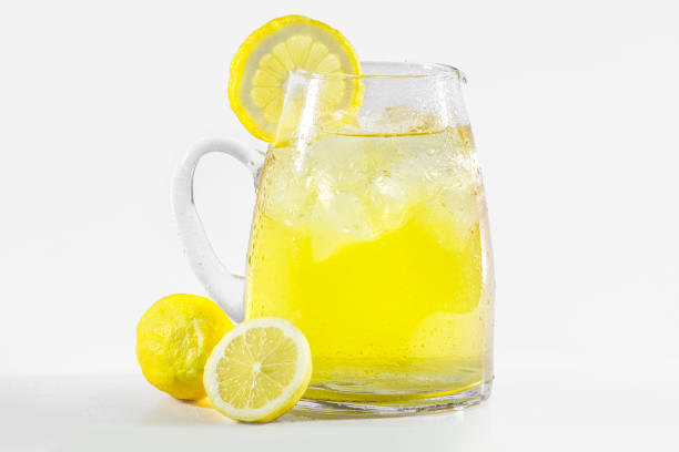 istock glass of lemonade with lemons in a white background 1502846013