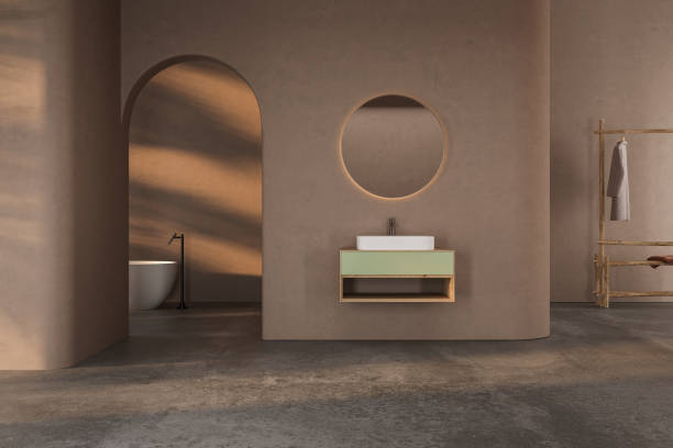 istock Soft natural light blended with natural materials for a relaxing and sophisticated minimal bathroom has marble basin, oval mirror, toilet, bidet, arch, trend. 3d rendering 1502848020