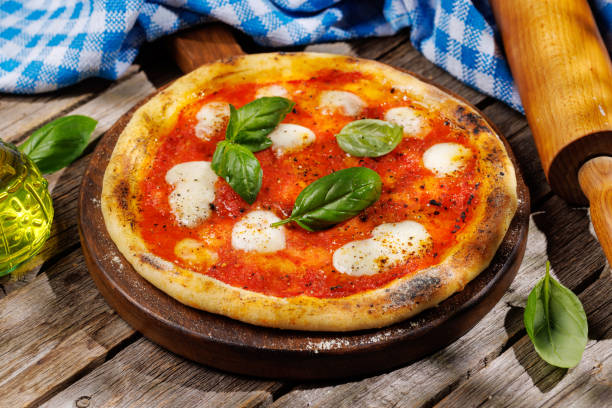 istock Margarita pizza with tomatoes, mozzarella cheese and basil 1502854930