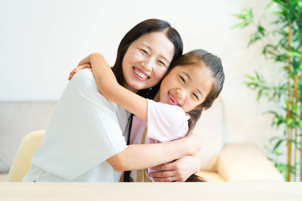 istock Parent and child hugging with a smile 1502856931