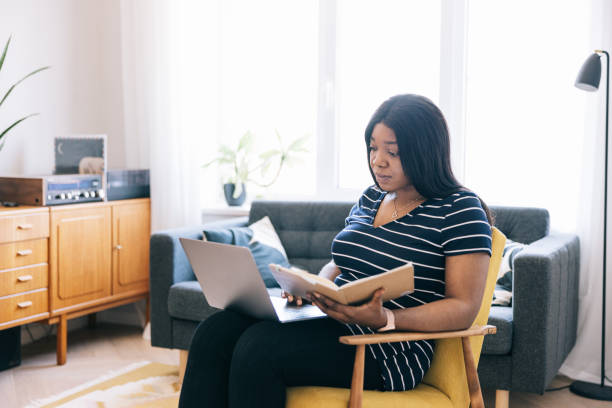 istock Young black female entrepreneur working from home 1502857128