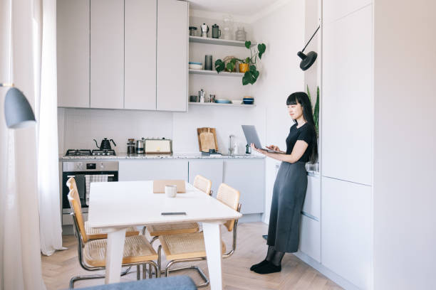 istock Female freelancer joining a video call from her kitchen 1502857134