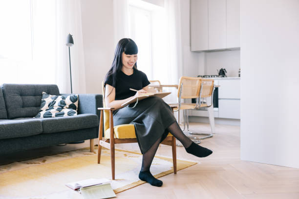 istock Female freelance writer working from home 1502857146