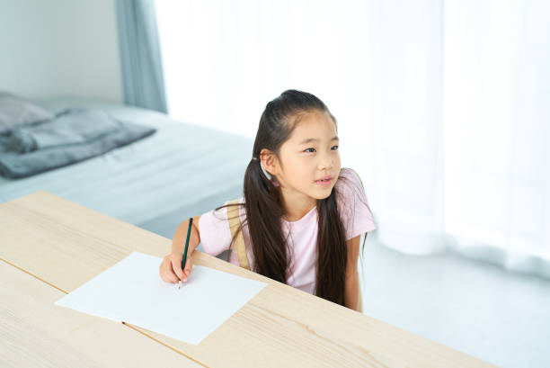 istock A girl listens to teacher 1502859793