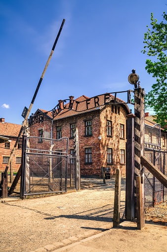 Oswiecim, Poland - May 12, 2016: Gate entrance to concentration camp Auschwitz with a sign Arbeit Macht Frei in Oswiecim, Poland.