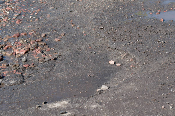 damaged road pavement - abstract textured textured effect real estate imagens e fotografias de stock