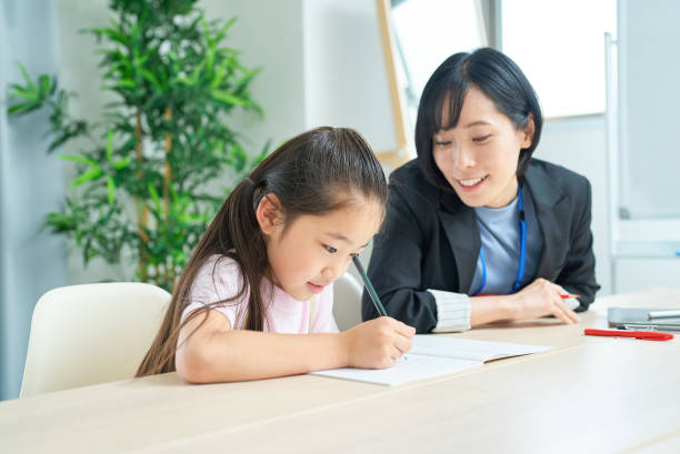 istock A girl studying and a woman in a suit to support 1502864346