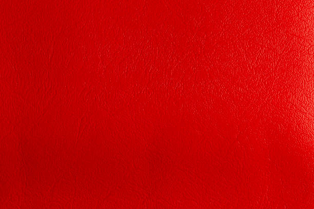 pelle rossa e uno sfondo strutturato. - car leather hide seat foto e immagini stock