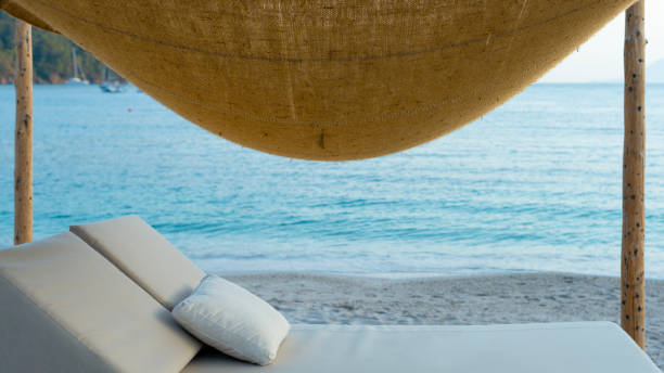istock hat and sunglasses on the beach 1502866181