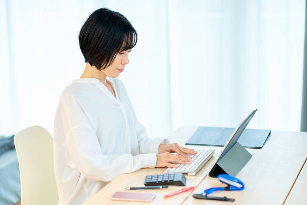istock woman using laptop in the room 1502868972