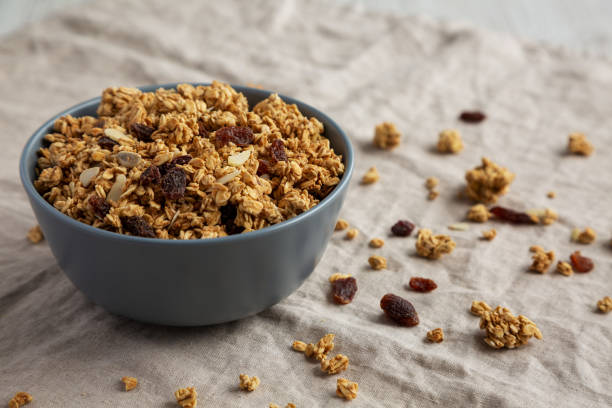 istock Homemade Granola with raisins and almonds  in a Bowl, side view. Copy space. 1502869179