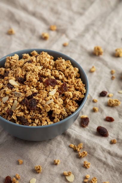 istock Homemade Granola with raisins and almonds  in a Bowl, side view. 1502869233