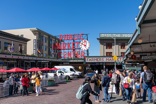 Seattle, WA, USA-July 2022; View of entrance with neon letter signage on the building of Pike Place Market, the oldest continuously operated public farmers markets in the United States