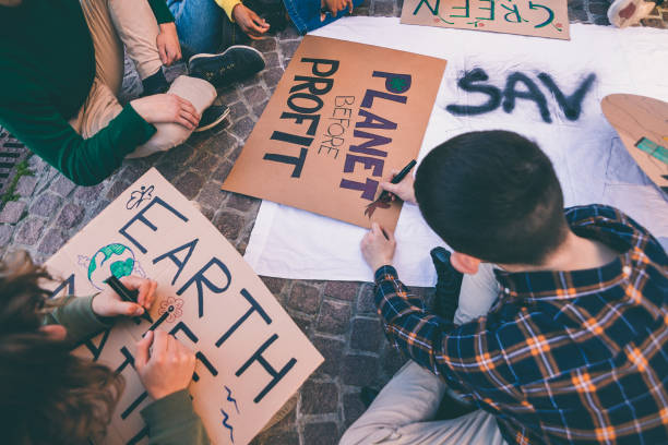 istock young people prepare demonstration placards in preparation for climate change protest march 1502873154