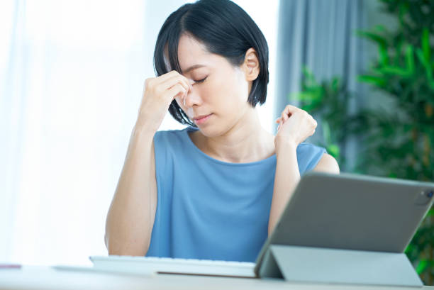 istock A woman who looks tired in front of a computer 1502874287