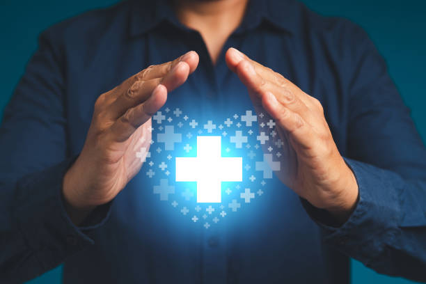 istock Hands businessman protect blue virtual medical icons. 1502874930