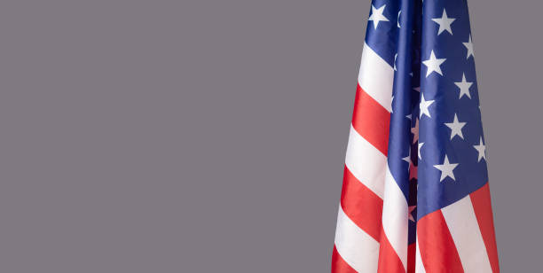 istock The American flag is on the right side on a gray background 1502875239