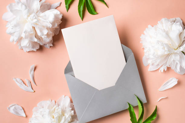 Greeting or invitation blank card and peony flowers