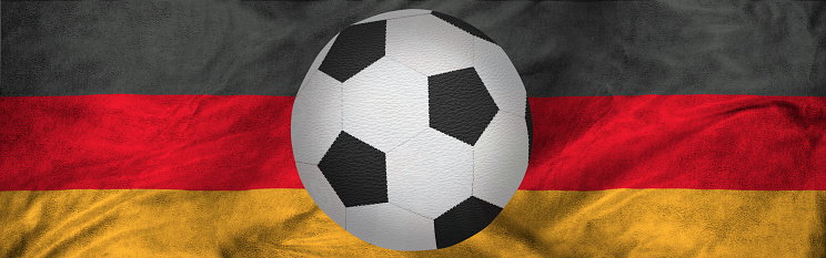 The image of a soccer ball against the background of the national flag of Germany