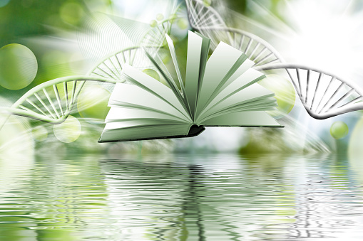Abstract image of an open book above the surface of the water against the background of stylized models of DNA chains