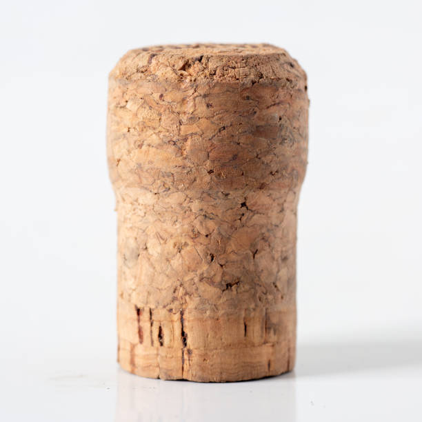 istock Wine and chapagne corks with a corkscrew and a glass bowl in the background, 1502879709
