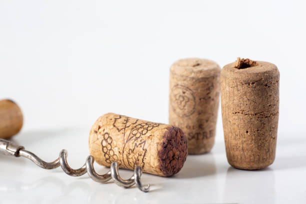 istock Wine and chapagne corks with a corkscrew and a glass bowl in the background, 1502879775